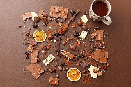 糖果,糖果食品热巧克力与坚果,肉桂可可粉棕色背景热巧克力加坚果,可可粉糖果图片