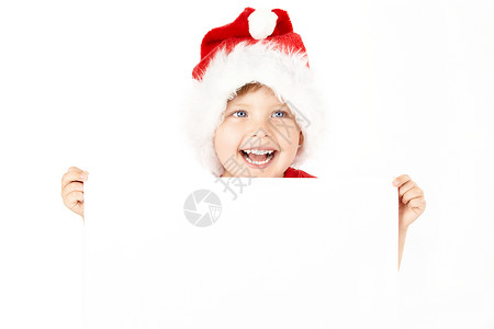 穿着圣诞老人帽子的男孩着白纸图片