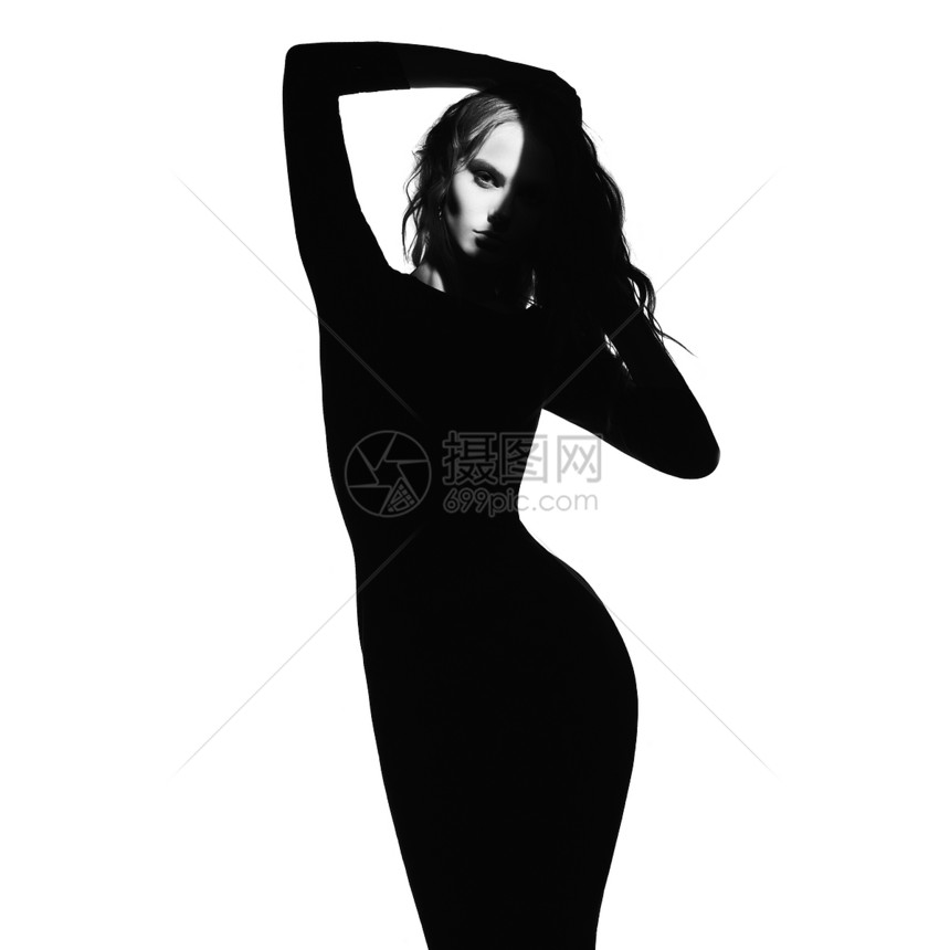 黑白艺术时尚肖像美丽的女人与光束她的脸上模特白色背景上摆姿势图片