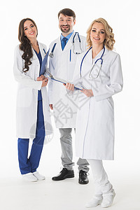 医生工作室成功的医生队正看镜头微笑,工作室孤立白色背景上医生队背景