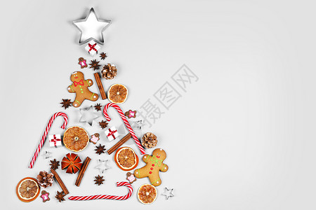 白纸背景上由食物装饰制成的圣诞树圣诞节假期平躺圣诞节假期图片