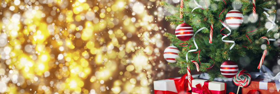 装饰圣诞树礼品盒背景,金色博克背景装饰圣诞树图片