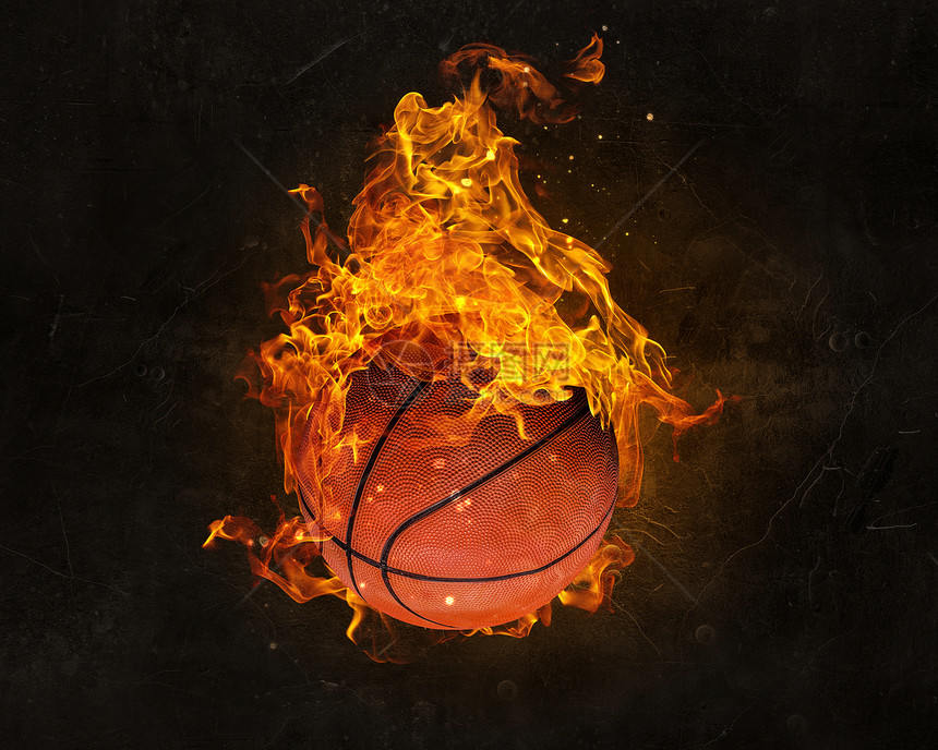 黑暗背景下的火焰中的球篮球比赛的图片