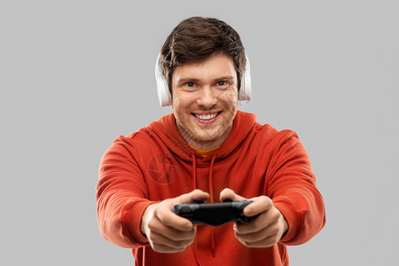 技术,游戏人的轻人玩家耳机与游戏广告玩电子游戏玩电子游戏的玩游戏的人图片