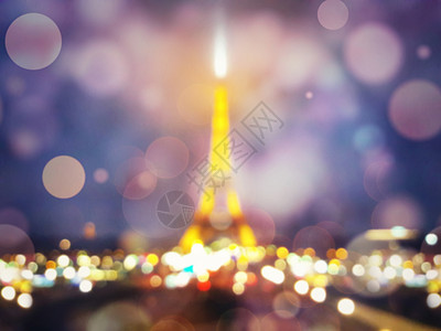 模糊的夜景埃菲尔铁塔的轮廓巴黎闪耀着的波克五颜六色的灯光浪漫的象征背景背景图片