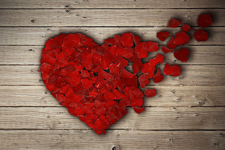红色玫瑰花瓣排列成破碎的心木桌上心碎分手分离离婚图标医学心血管健康的象征背景图片