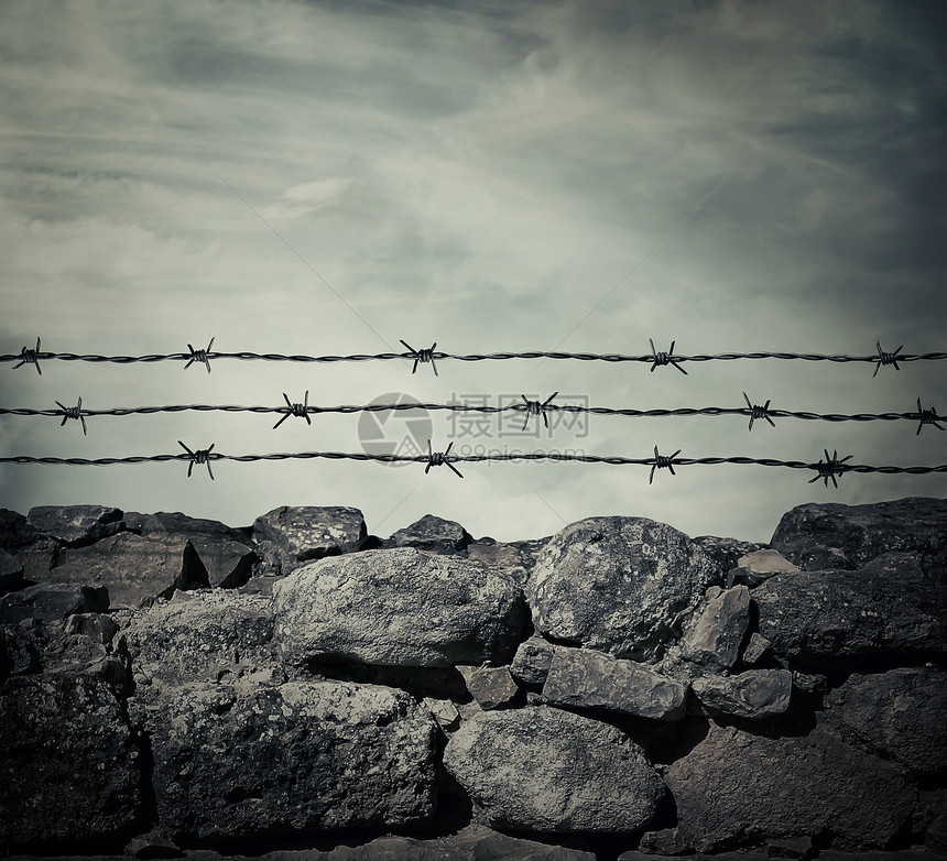 监狱的石墙围栏,铁丝网图片