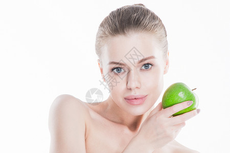 美丽的女人,健康的皮肤,着绿色的苹果,孤立白色的背景上女人着绿色的苹果图片