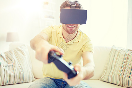 技术,游戏,娱乐活动人的快乐的轻人与虚拟现实耳机3D眼镜与控制器游戏垫家里玩赛车电子游戏人虚拟现实耳机与控制器背景图片
