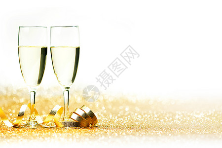 金色闪光的香槟杯卷曲的装饰丝带图片