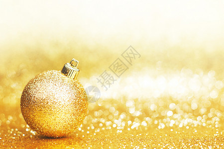 美丽的金色诞球抽象闪光背景特写图片