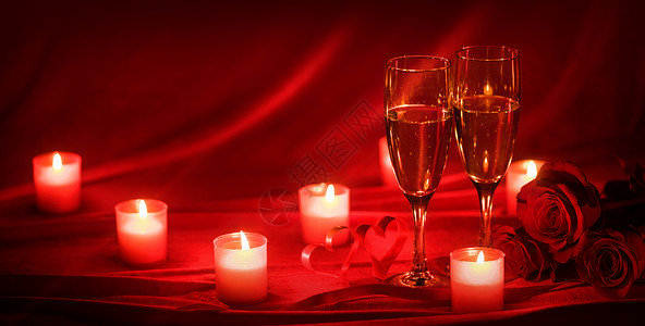 情人节庆祝活动,杯香槟,蜡烛,玫瑰红丝上的心香槟蜡烛背景图片
