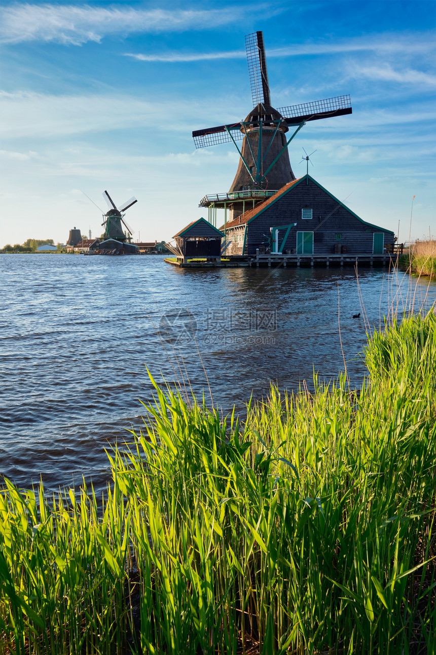 日落时,荷兰著名的旅游景点ZaanseSchans的风车Zaandam,荷兰日落时荷兰的赞斯山的风车赞丹姆,尼瑟图片