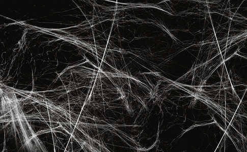 黑色背景上的人造蜘蛛网背景图片
