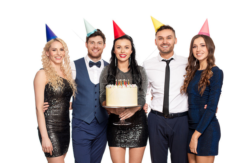 庆祝问候生日聚会上戴着大蛋糕的派帽的快乐朋友生日聚会上带大蛋糕的快乐朋友图片