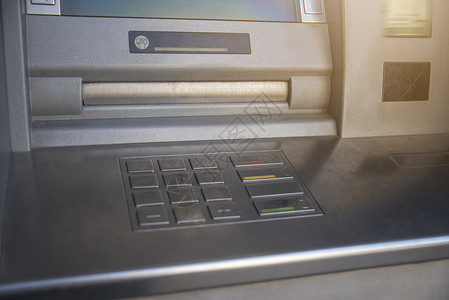 atm取款提款机ATM矗立城市的街道上背景
