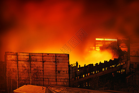 城市火灾晚上商店里的大火建筑物被烧毁倒塌背景