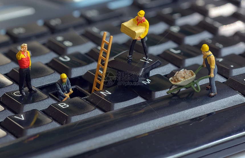 工人雕像修理键盘图片