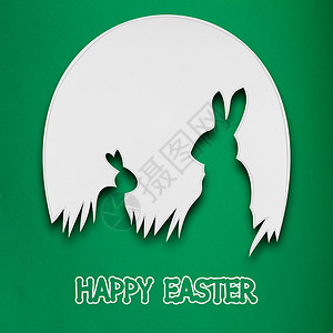 创意复活节照片,两只兔子个鸡蛋由纸绿色背景图片