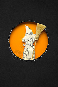 女巫素材创意万节照片女巫与扫帚制成的纸张黑色橙色背景背景