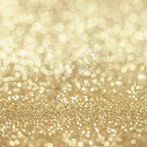 抽象的金色闪光背景抽象的金色闪光灯光波基假日派背景图片