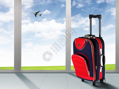 蓝色天空中的红色手提箱飞机高清图片