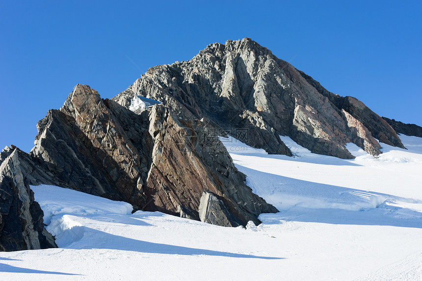 雪山自然的山景,雪晴朗的蓝天图片
