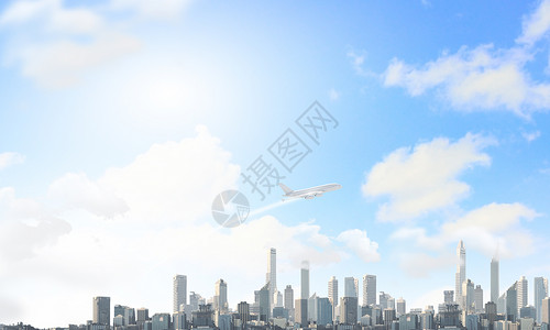 空中的飞机飞机城市上空高高飞图片
