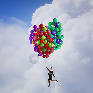 女人坐气球飞穿西装戴礼帽的女商人气球上飞行图片