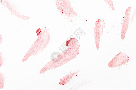 散落的粉末白色背景上粉红色粉末的抽象图像图片