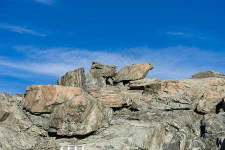 新西兰清澈蓝天的石岩自然景观雪高清图片素材