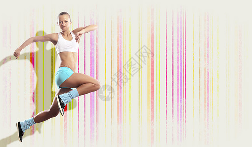 运动女跳跃的形象运动女孩彩色背景下跳跃的形象图片