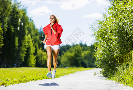 运动女孩轻迷人的女人户外跑步的形象背景图片