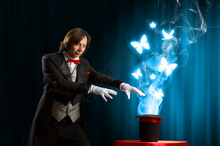 戴帽子的魔术师魔术师用魔法帽子表演魔术的形象背景