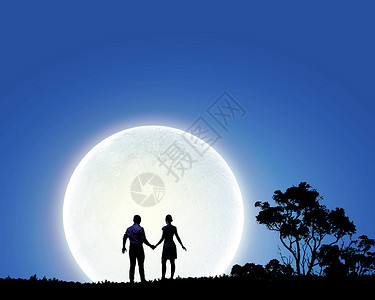 浪漫的站月光下的轻浪漫夫妇的剪影满的高清图片素材