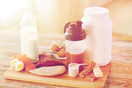 健肌粉运动,健身,健康的生活方式,饮食人的密切天然蛋白质食品添加剂木制桌子上背景