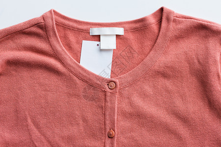 标签按钮服装,穿着,时尚物品的羊毛衫与价格标签用价格标签开衫背景