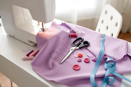 缝纫,技术裁剪缝纫机与剪刀,按钮,卷尺物缝纫机,剪刀,纽扣布料背景图片