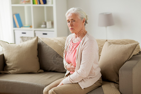 分泌失调老健康问题人们的观念老妇女家里胃痛老妇女家胃痛背景