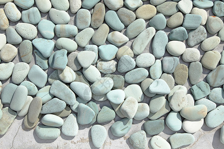 鹅卵石抽象的背景与干燥的彩色卵石背景图片