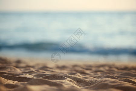 海滩的沙子海滩的沙子,模糊的海洋背景图片