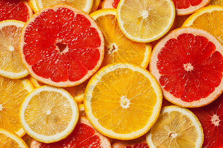 彩色柑橘类水果柠檬,橘子,柚子片背景高清图片