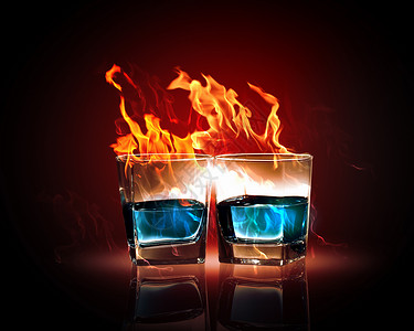 两杯燃烧的翡翠苦艾酒两杯燃烧的翡翠苦艾酒的图像高清图片