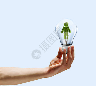 绿色灯泡生态人的手着灯泡,植物形状像人背景