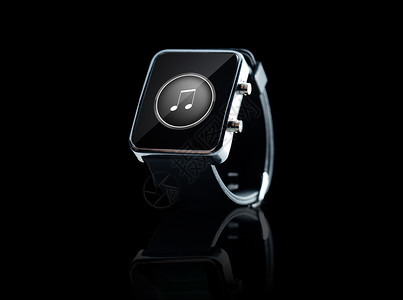 现代技术,媒体,象媒体黑色智能手表与音乐音符图标屏幕上的黑色背景图片