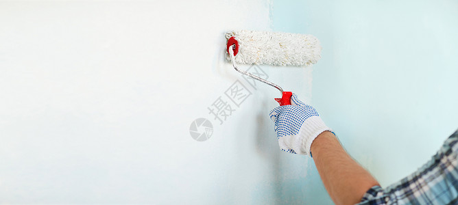 修理,建筑家庭男手套油漆墙与滚筒背景图片