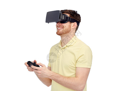 三维技术,虚拟现实,娱乐活动人的快乐的轻人与虚拟现实耳机3D眼镜玩游戏控制器游戏背景图片