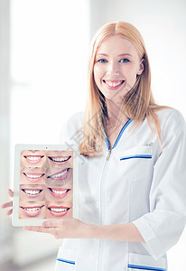 医疗保健,医疗口腔科女医生与平板电脑微笑图片