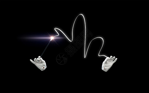 表演,幻想,马戏,表演魔术师的手手套与照明魔杖魔术黑色背景背景图片
