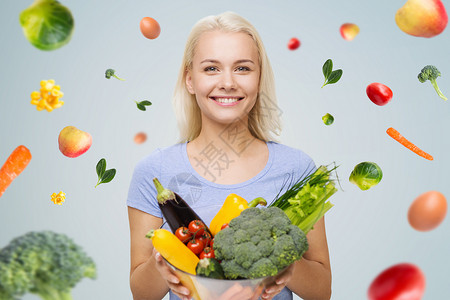 健康的饮食,素食,节食人们的微笑的轻女人与碗蔬菜灰色背景与下降的蔬菜图片